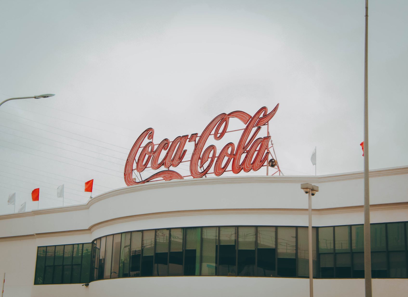 Coca Cola logo on top pf a building